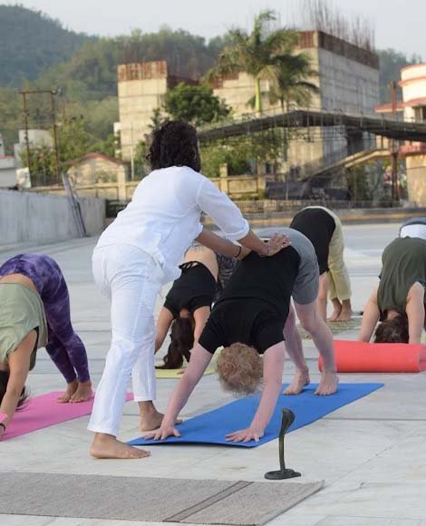 Yoga teacher training class by the Ganga in Rishikesh