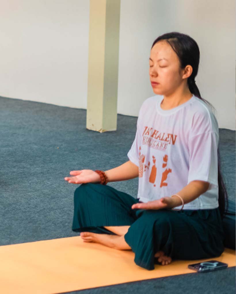 Group meditation session during yoga teacher training