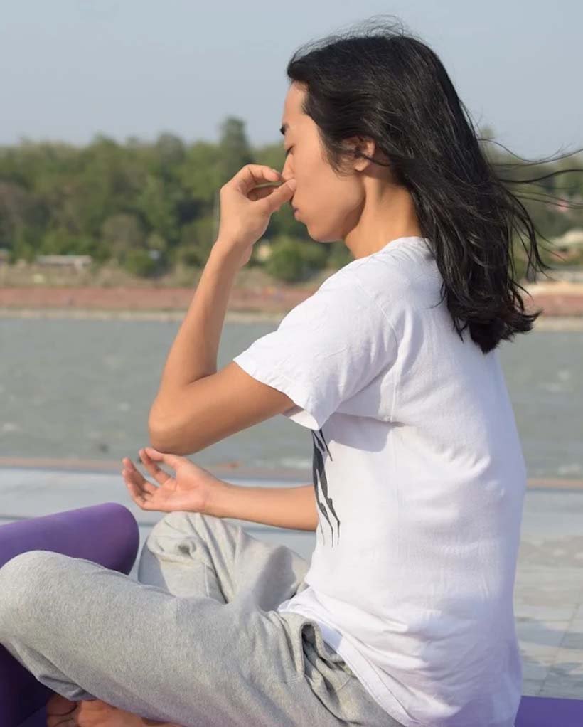 Students practising pranayama breathing exercises