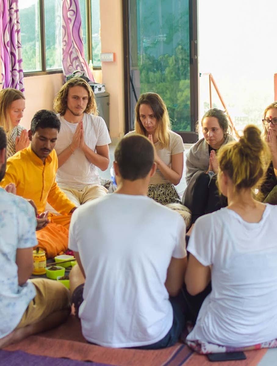 Yoga teacher guiding students at Avatar Yoga School in Rishikesh